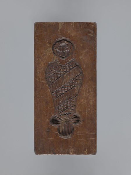 Double-sided gingerbread form. Side A: female figure; Side B: baby in swaddling clothes. Maker