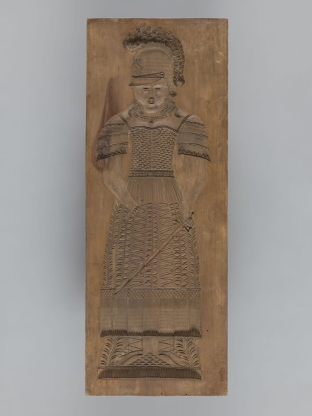 Double-sided gingerbread form. Obverse: female figure in a helmet; reverse: male figure in a helmet