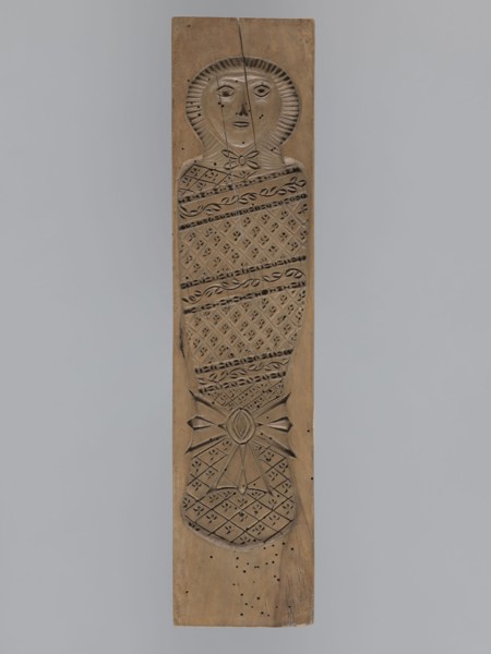 Double-sided gingerbread mold. Obverse: baby in swaddling clothes richly decorated with various