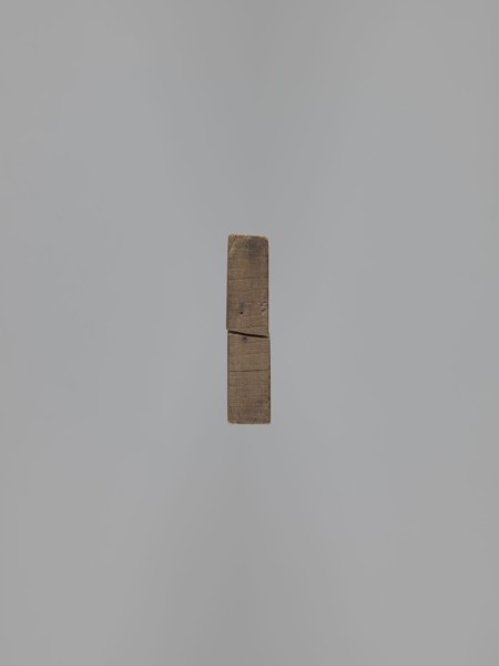 Double-sided gingerbread mold. Obverse: baby in swaddling clothes richly decorated with geometric