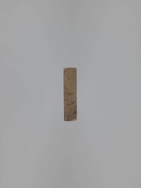 Double-sided gingerbread mold. Obverse: baby in swaddling clothes richly decorated with geometric