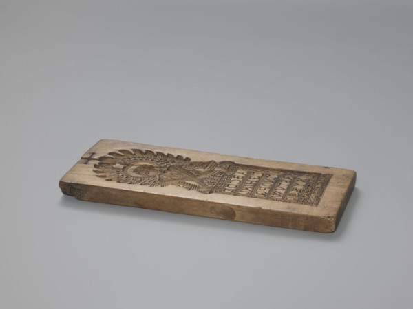 Double-sided gingerbread form. Obverse: figure of an angel with the alphabet. Reverse: various