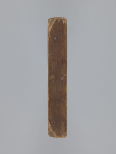 Double-sided gingerbread mould. Obverse: oval frame with a decorative vase of flowers surrounded by