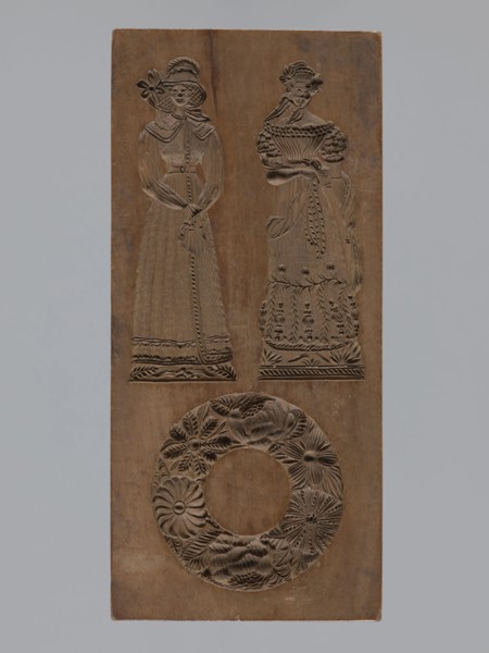 Double-sided gingerbread mould. Obverse: two female figures and a wreath; Reverse: two male figures