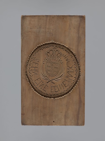 Double-sided gingerbread mould. Obverse: rectangular mould with an oval coat of arms in a