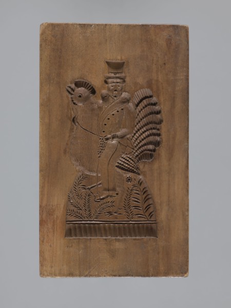 Double-sided gingerbread mold. Obverse: male figure on a rooster; reverse: bird. Double-sided