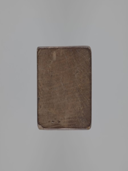 Double-sided gingerbread mould; obverse: stylised elongated fish covered with scales, shown in