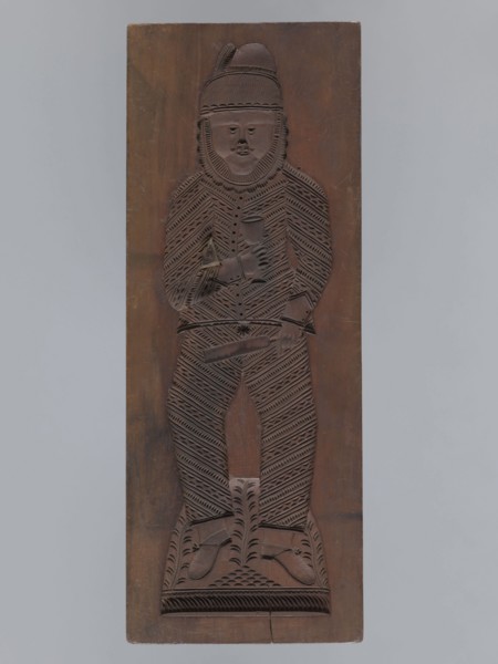 Double-sided gingerbread form. Obverse: male figure with a chalice in hand; reverse: baby in