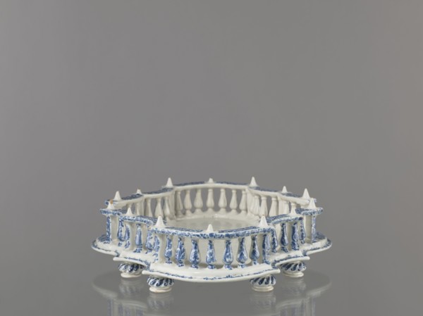 Base for a tabletop tray. Oval architectural tray base carved with 4 leaves and a wavy edge