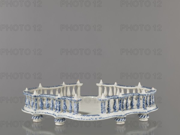 Base for a tabletop tray. Oval architectural tray serving as a base for a tabletop tray. Carved