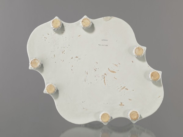 Base for a tabletop tray. Oval architectural tray serving as a base for a tabletop tray. Carved