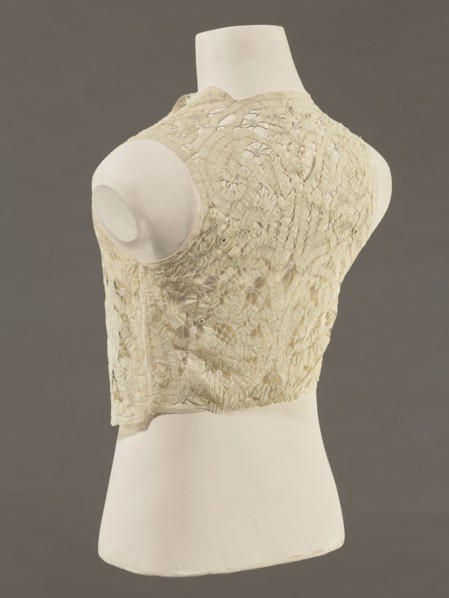Bodice, lace; bodices; women's clothing; fashion. Pattern of rosettes connected by large spiders