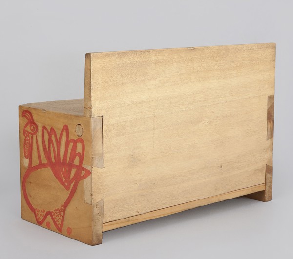 Wooden bench from a set of doll furniture. Wooden bench with a box closed by a flap forming a seat.