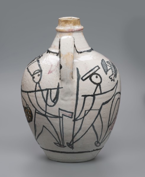 A painted ceramic jug with handle featuring stylized figures of people robbers and musicians and