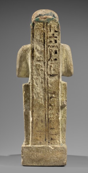 Figurine of the god Ptah. Figural sculpture of Ptah seated on a throne on a base in the shape of