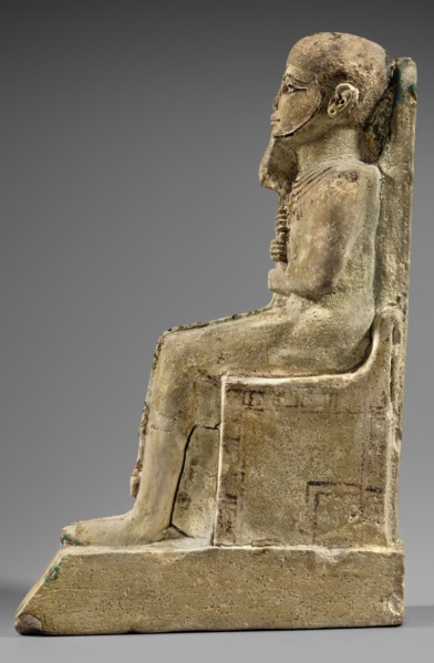 Figurine of the god Ptah. Figurine of the god Ptah sitting on a throne, on a base in the shape of