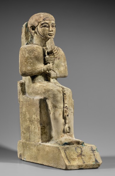 Figurine of the god Ptah. Figurine of the god Ptah sitting on a throne, on a base in the shape of