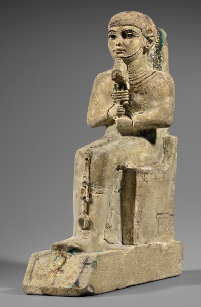 Figurine of the god Ptah. Figurine of the god Ptah sitting on a throne, on a base in the shape of