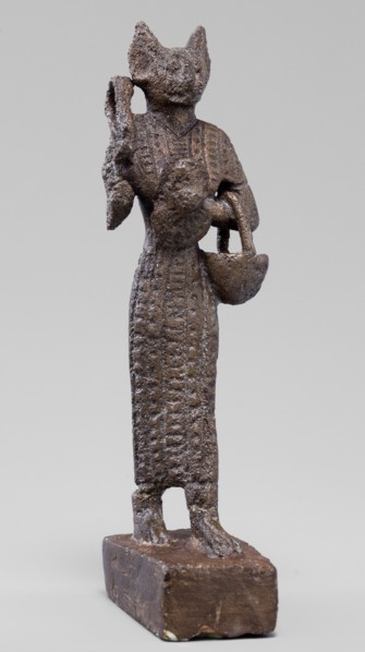 Figurine of the goddess Bastet. Figurine of a goddess with a cat's head, dressed in a