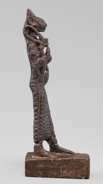 Figurine of the goddess Bastet. Figurine of a goddess with a cat's head, dressed in a