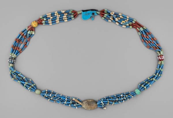 Necklace with a scarab and an udjat eye. Necklace composed of six rows of faience tubular and