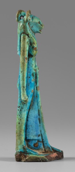 Amulet - figurine of a lion-headed goddess. A lion-headed goddess, in a tripartite wig and a narrow