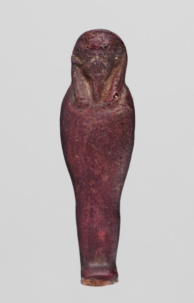 Amulet - mummy-shaped figurine;, Mummy-shaped figurine, back smooth; dark red glass; Ptolemaic