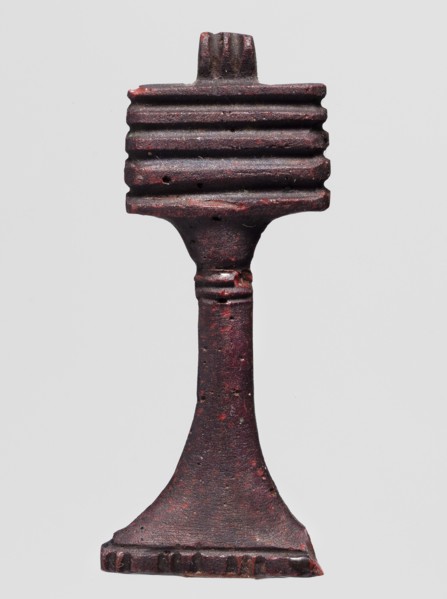 Amulet - djed pillar, A brown glass amulet in the shape of a djed pillar with five crossbars and a
