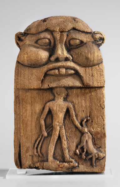 Magical stele topped with the mask of the god Bes. Magical stele cippus depicting in the lower