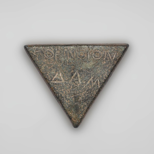 Weight 1/6 mina. Weight in the shape of an isosceles triangle. On the weight is a two-line