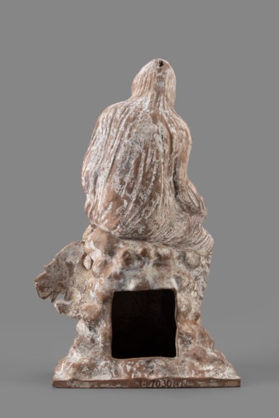 Figurine of Leda with a Swan, A woman sits on a rock and feeds a swan standing next to her. She is