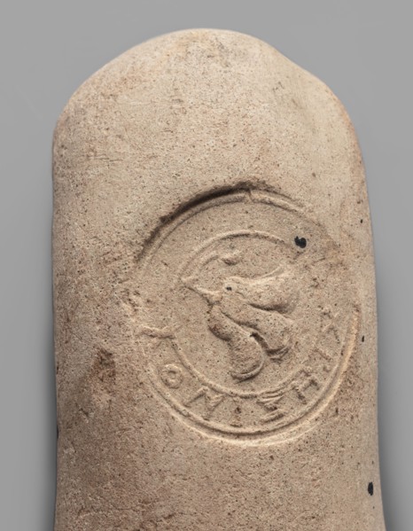 Fragment of a transport amphora vice stamped with a Rose of Rhodes and the inscription Chresimou,