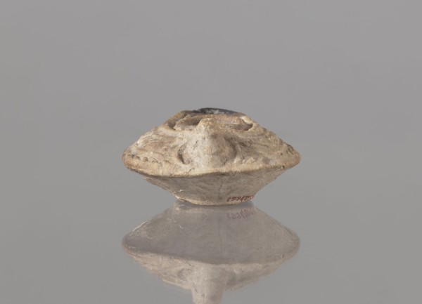 Oil lamp, unknown Palestinian workshop. Oval lamp with conical handle. Large olive opening