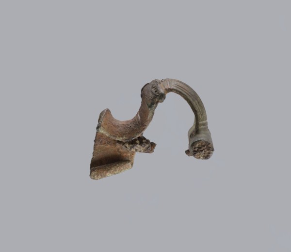 Brooch with a crossbar. Brooch with a bow made of a wide, slightly curved band decorated with