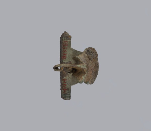 Brooch with a crossbar. Brooch with a bow made of a wide, slightly curved band decorated with