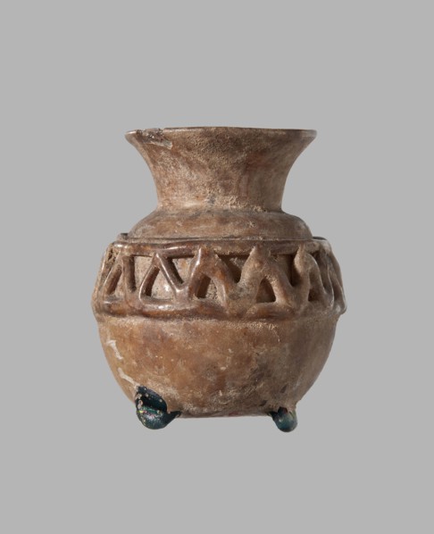 Cosmetic bottle. Spherical body decorated at the top with a zigzag pattern of applied glass thread.