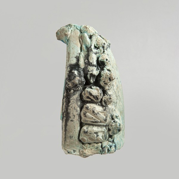 Fragment of a votive boat. Prow or stern with decoration in the form of glued appliqués. On the