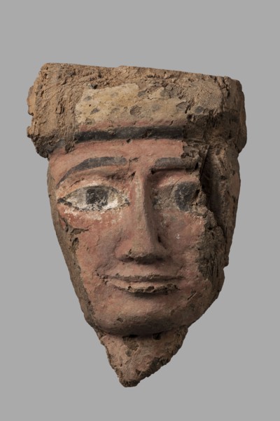 Sarcophagus mask with a partially preserved fragment of a wig above the forehead painted yellow