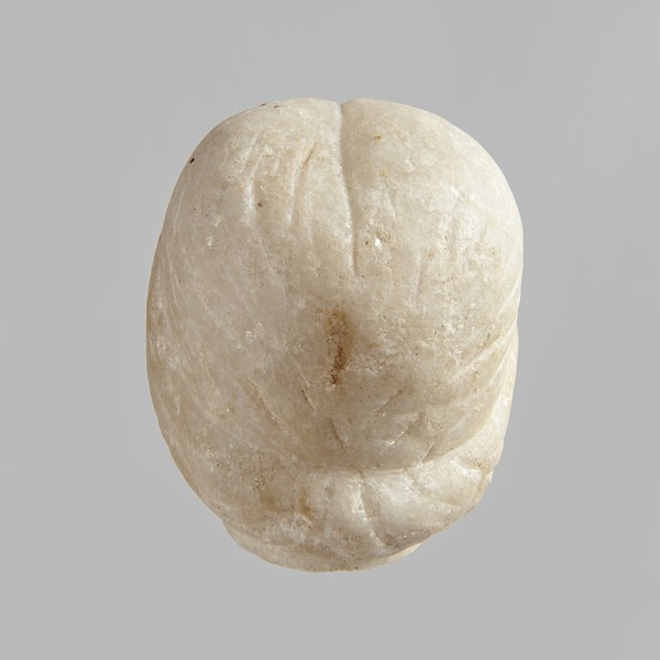 Fragment of a female figurine. Fragment of a small-sized sculpture or sculptural group with