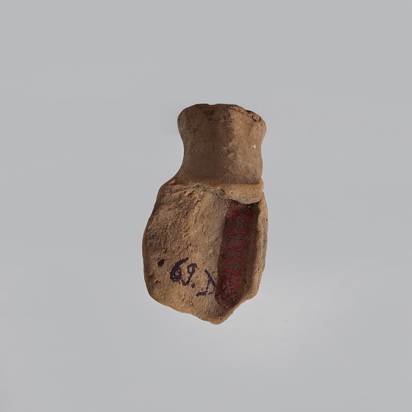 Serapis, fragment of a terracotta figurine head of Serapis with a kalathos on the head, lush curls