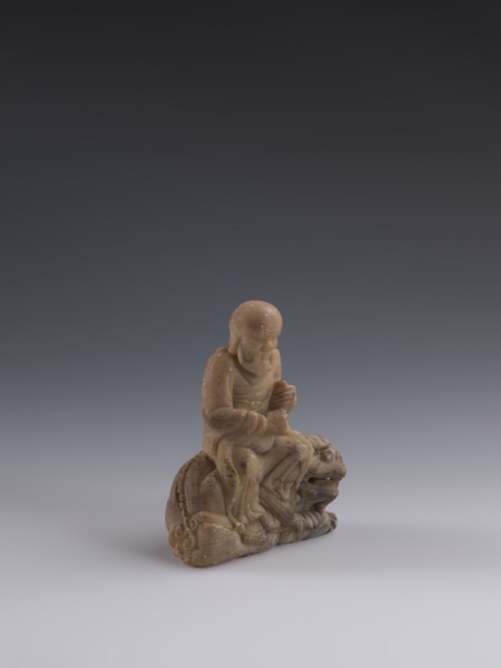 Luohan on a lion, arhat iconography, lion iconography, figurine, Chinese art, Chinese culture, Qing