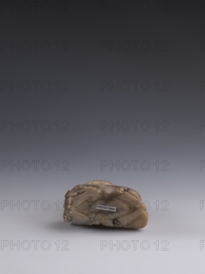 Luohan on a lion;, arhat iconography; lion iconography; figurine; Chinese art; Chinese culture;