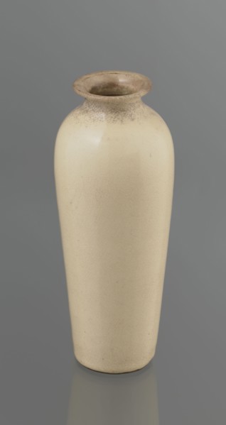 Cylindrical porcelain vase, tapering towards the bottom; flat rim. Light cream glaze with fine