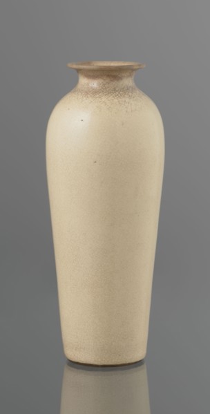 Cylindrical porcelain vase, tapering towards the bottom; flat rim. Light cream glaze with fine