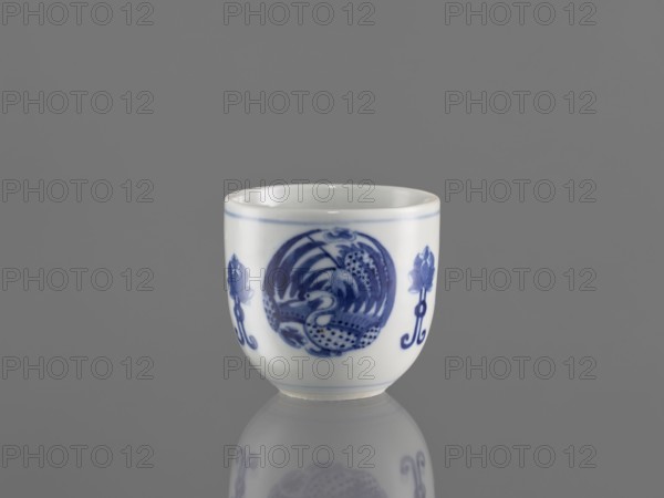Bowl, ceramics, decorated with three phoenix images and stylized lotus flowers; blue-and-white