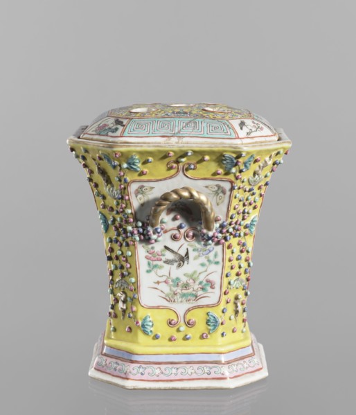 Vase with a lid; ceramics, colored porcelain; openwork, flat perforated lid; decorated with