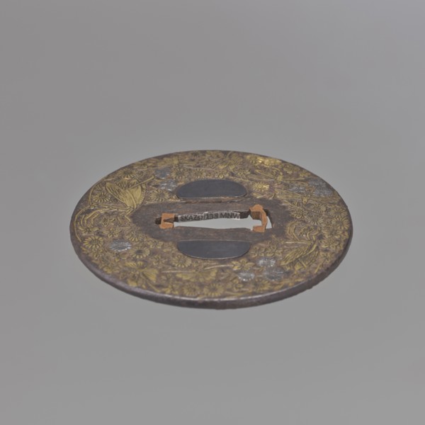 Crossguard tsuba, Mino school, Japanese, Edo period 18th century. Iron round tsuba maru gata with