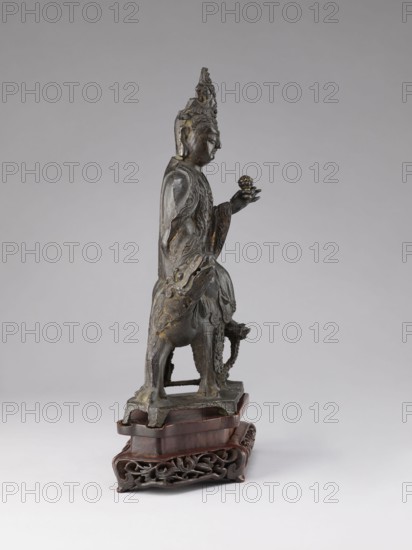 Buddhist deity on a buffalo on a base; figurine; Chinese; Chinese Buddhism; lotus iconography; Qing