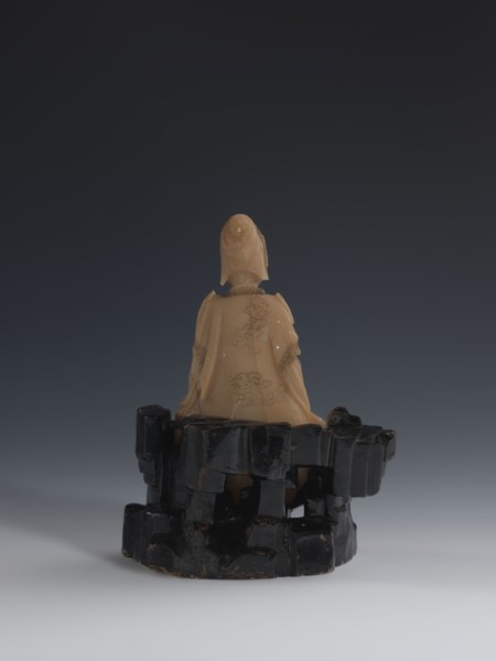 Guanyin Giving Birth to a Son on a Rock; sculptor unknown. Figurine of the goddess made of light