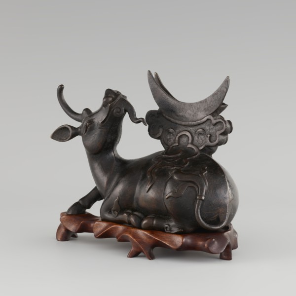 Mirror with TLV decoration on a pedestal in the form of a qilin on a base; Chinese, Qing dynasty